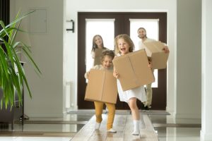 Kids running holding boxes