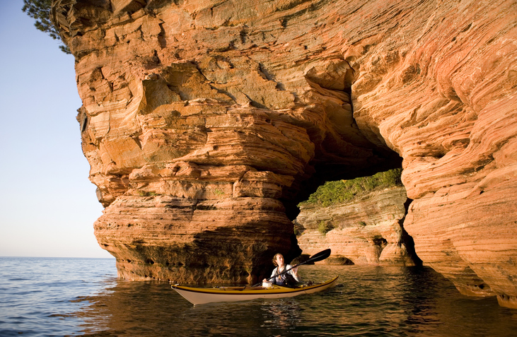 Woman Sea Kayaking in Apostle Islands.